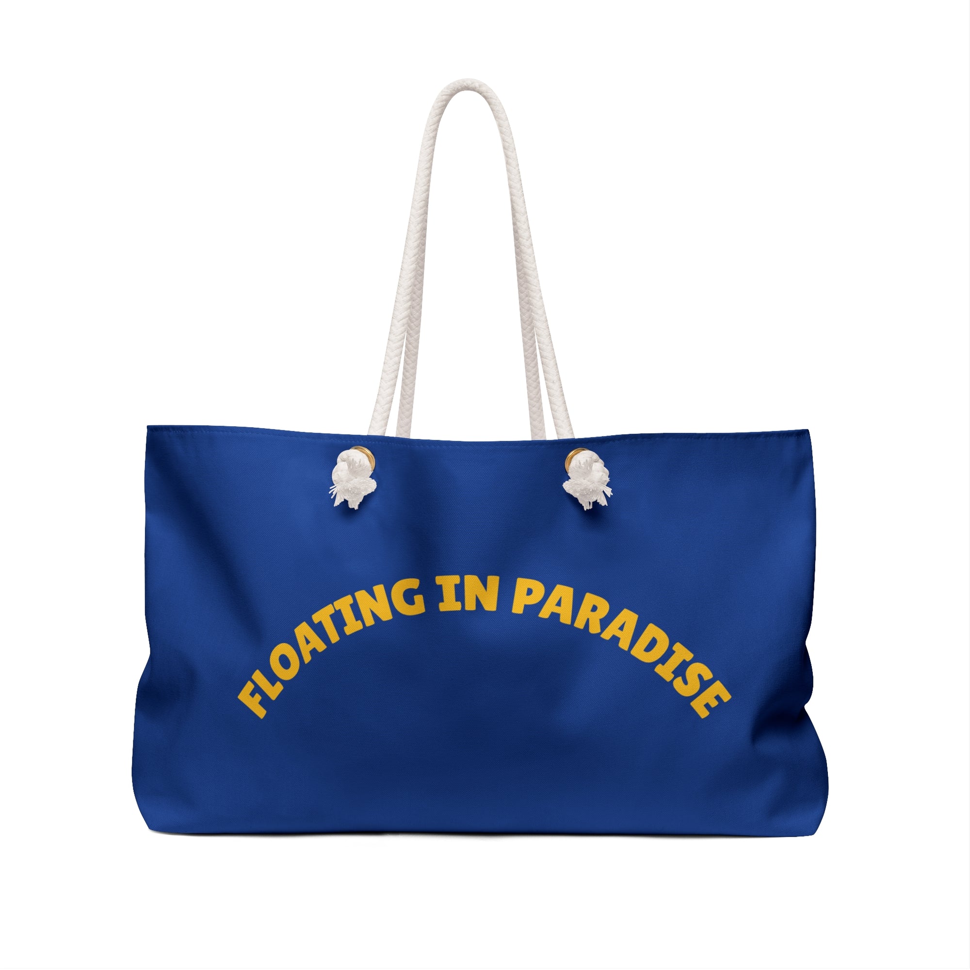 Blue tote bag with 'Floating in Paradise' text on a white background