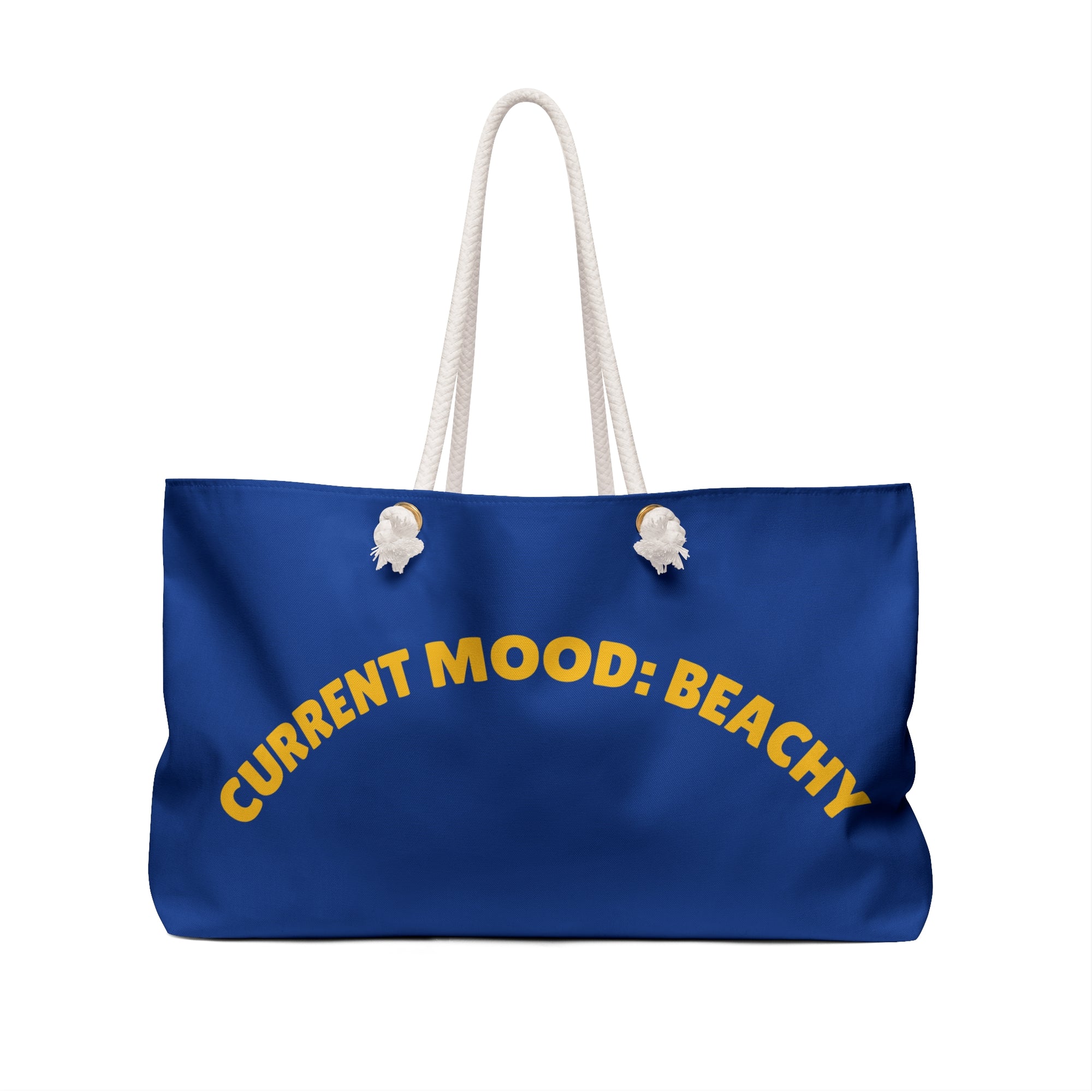 Blue tote bag with 'CURRENT MOOD: BEACHY' text on a white background
