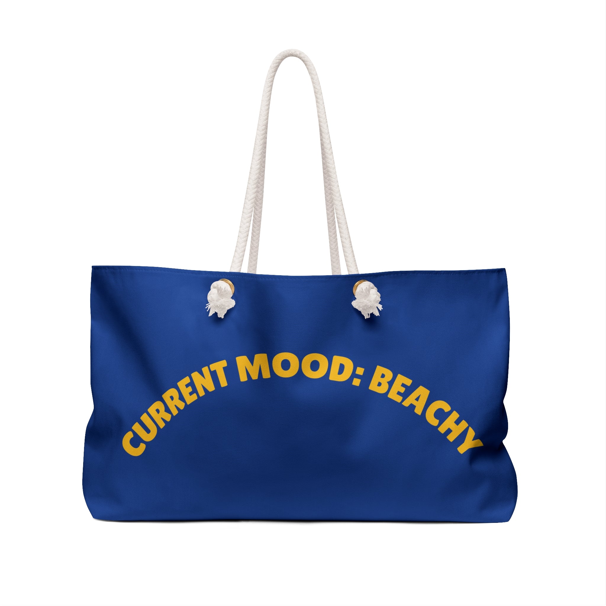 Blue tote bag with 'CURRENT MOOD: BEACHY' text on a white background